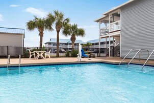 Seasonal outdoor pool, open 9:00 AM to 10:00 PM, pool umbrellas