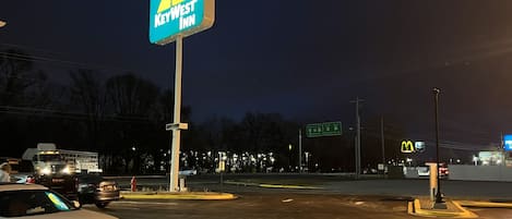 A parking lot with a KeyWest Inn sign, a McDonald's, and a fire hydrant.