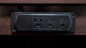 A power strip with three outlets, a USB port, and a switch. - Red Roof Inn PLUS+ & Suites Opelika (Opelika)