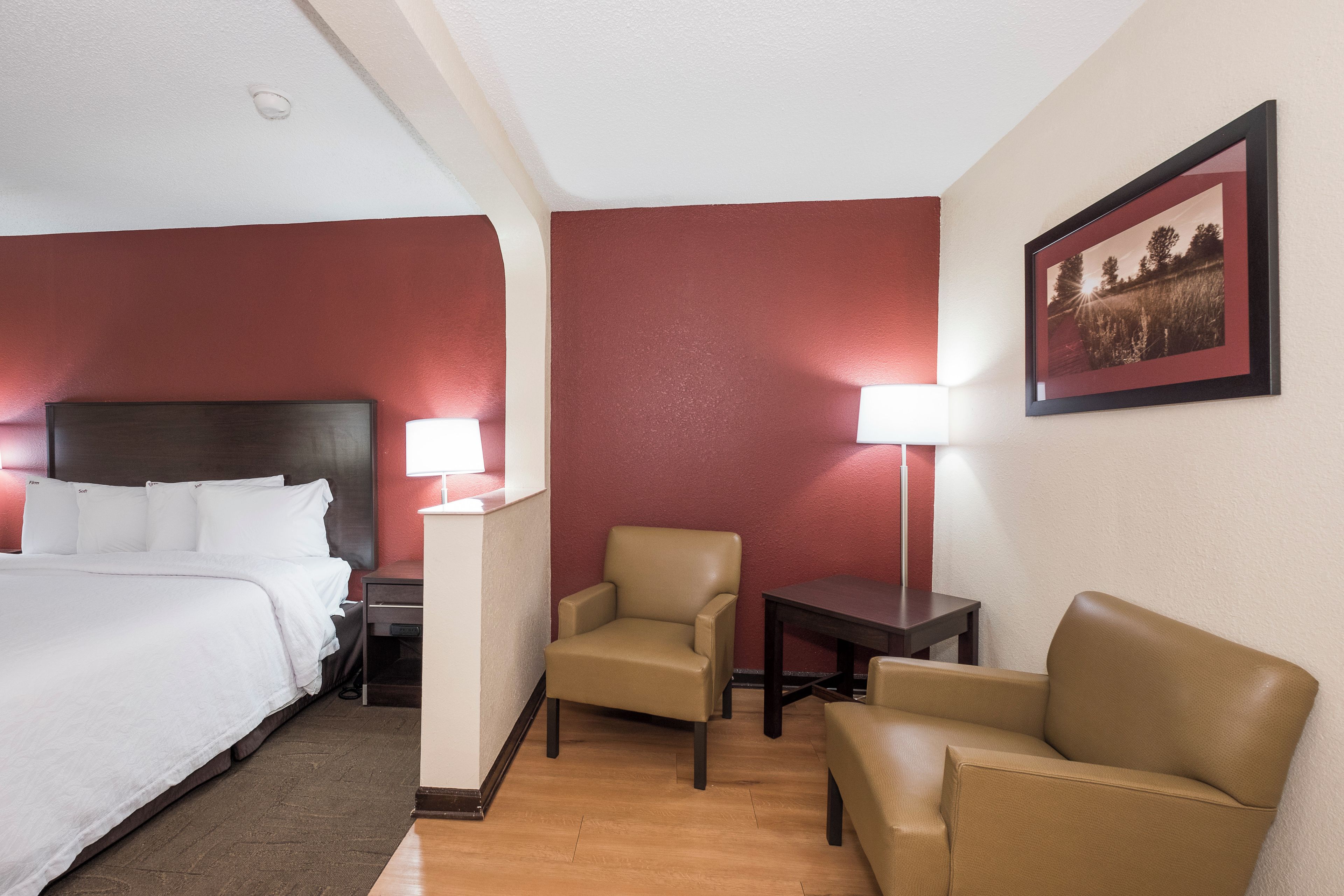 Premium bedding, desk, laptop workspace, blackout drapes