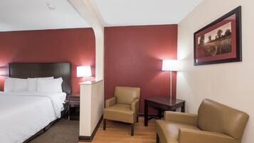 Premium bedding, desk, laptop workspace, blackout drapes