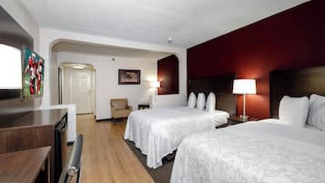 Premium bedding, desk, laptop workspace, blackout drapes