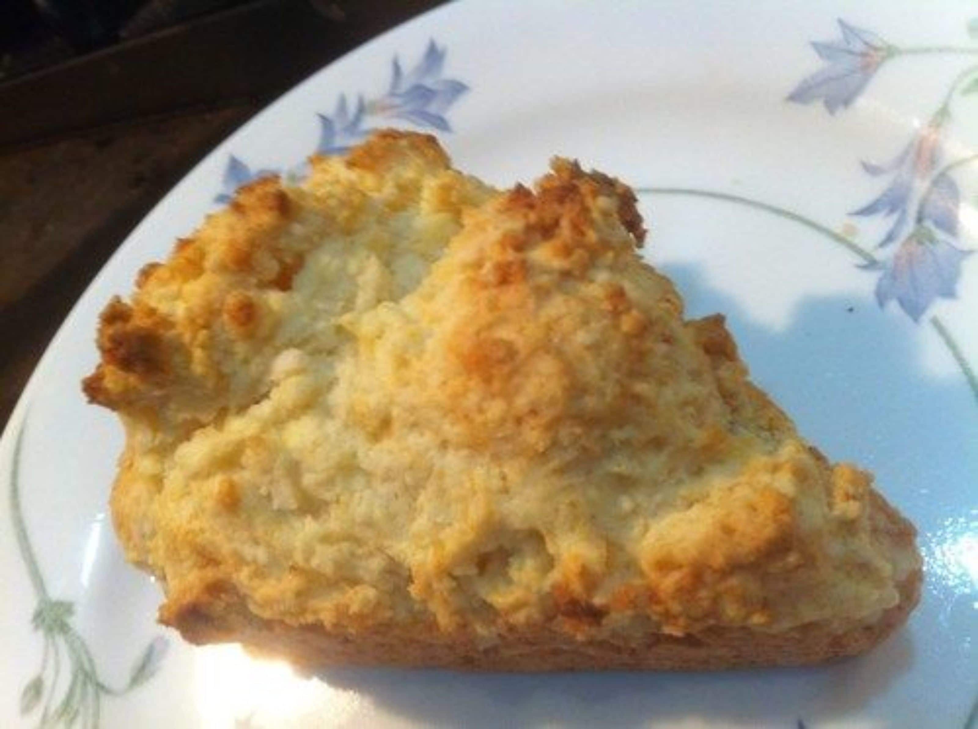 A slice of pie on a plate with a floral pattern.