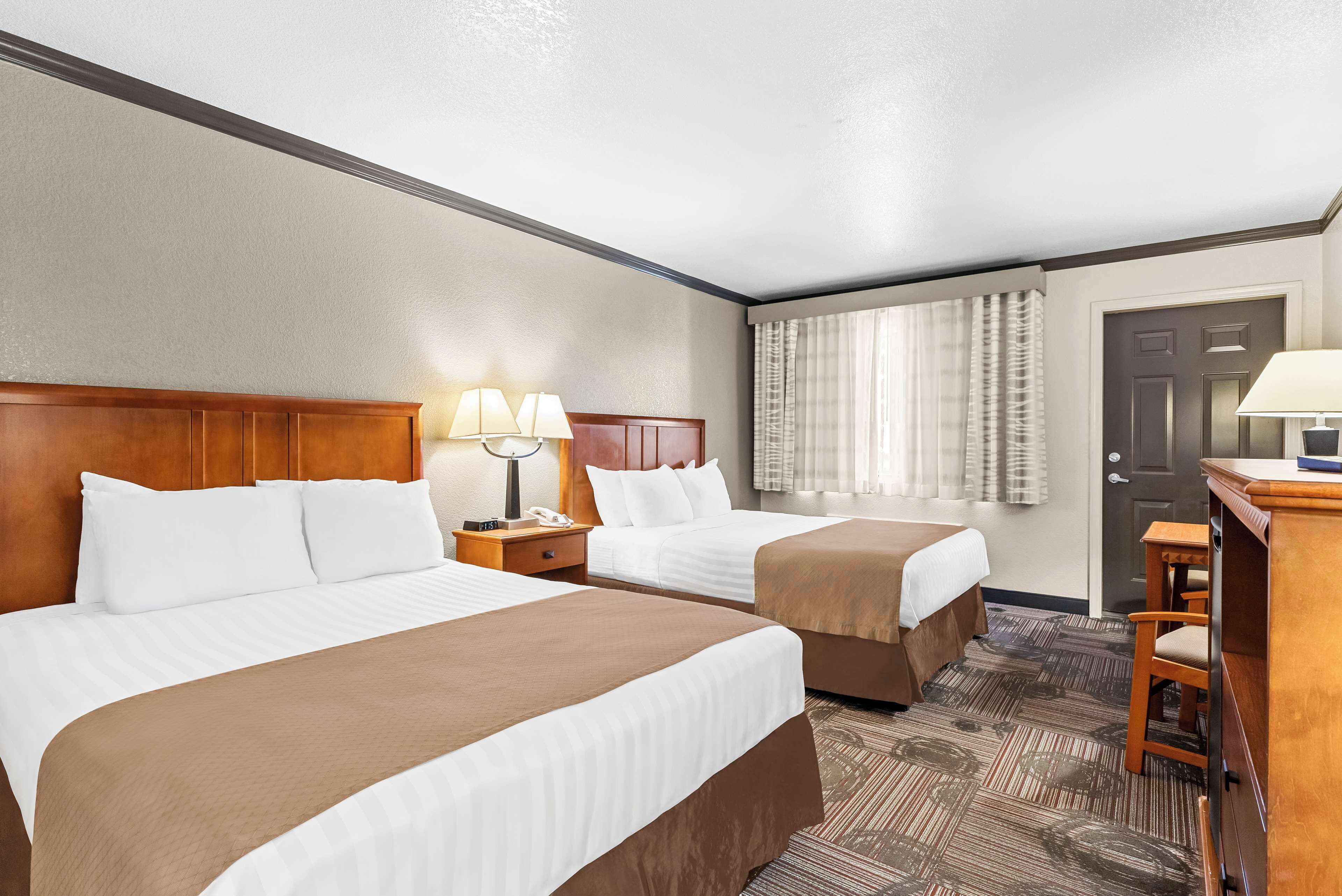 standard room, 2 queen beds, non smoking, refrigerator & microwave | desk, laptop workspace, free wifi, bed sheets