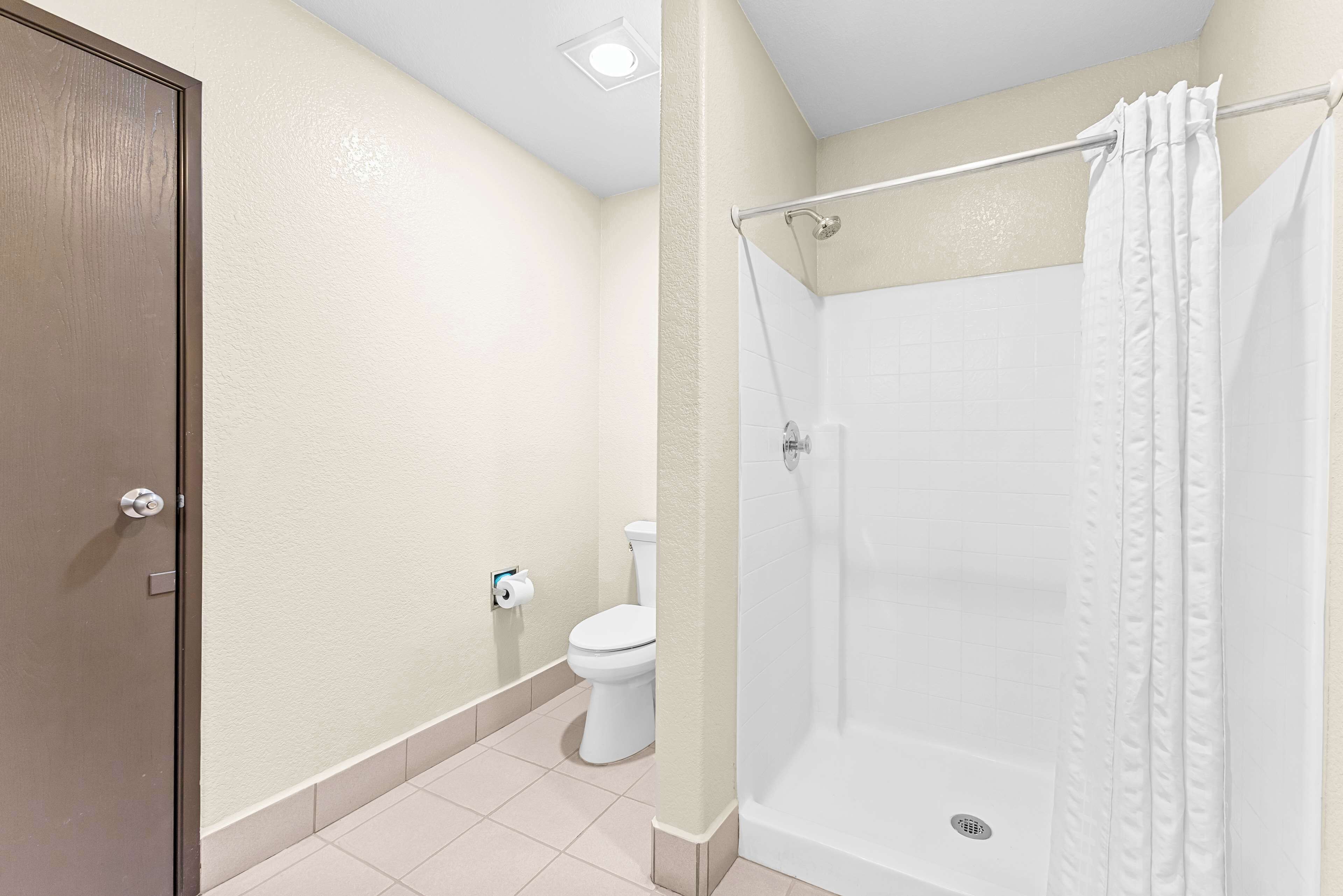 suite, 1 king bed, non smoking, refrigerator & microwave (oversized room;with sofabed) | bathroom | combined shower/bathtub, free toiletries, hair dryer, towels