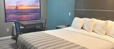 Chambre Simple, 1 très grand lit, non-fumeurs | Bureau, rideaux occultants, fer et planche à repasser, Wi-Fi gratuit