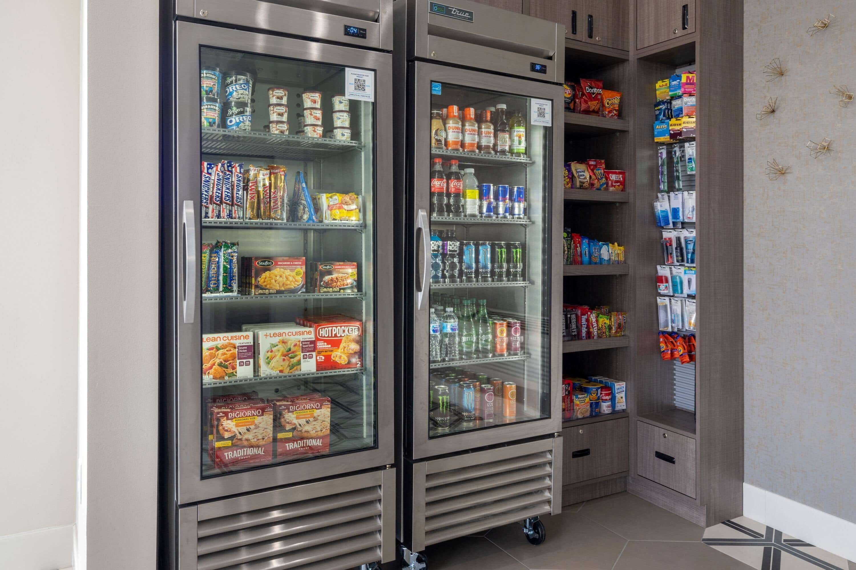 Two refrigerated display cases stocked with various food items and beverages.