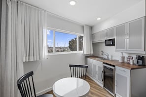 Premium Room, 1 King Bed, Kitchenette | Private kitchenette