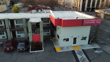 A building with a red and white sign labeled "University Inn."