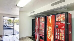 A vending machine area with Coca-Cola and Sprite machines.