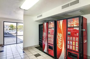 A vending machine area with Coca-Cola and Sprite machines.