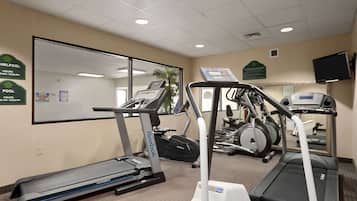 A fitness center with treadmills, an elliptical, and a stationary bike.