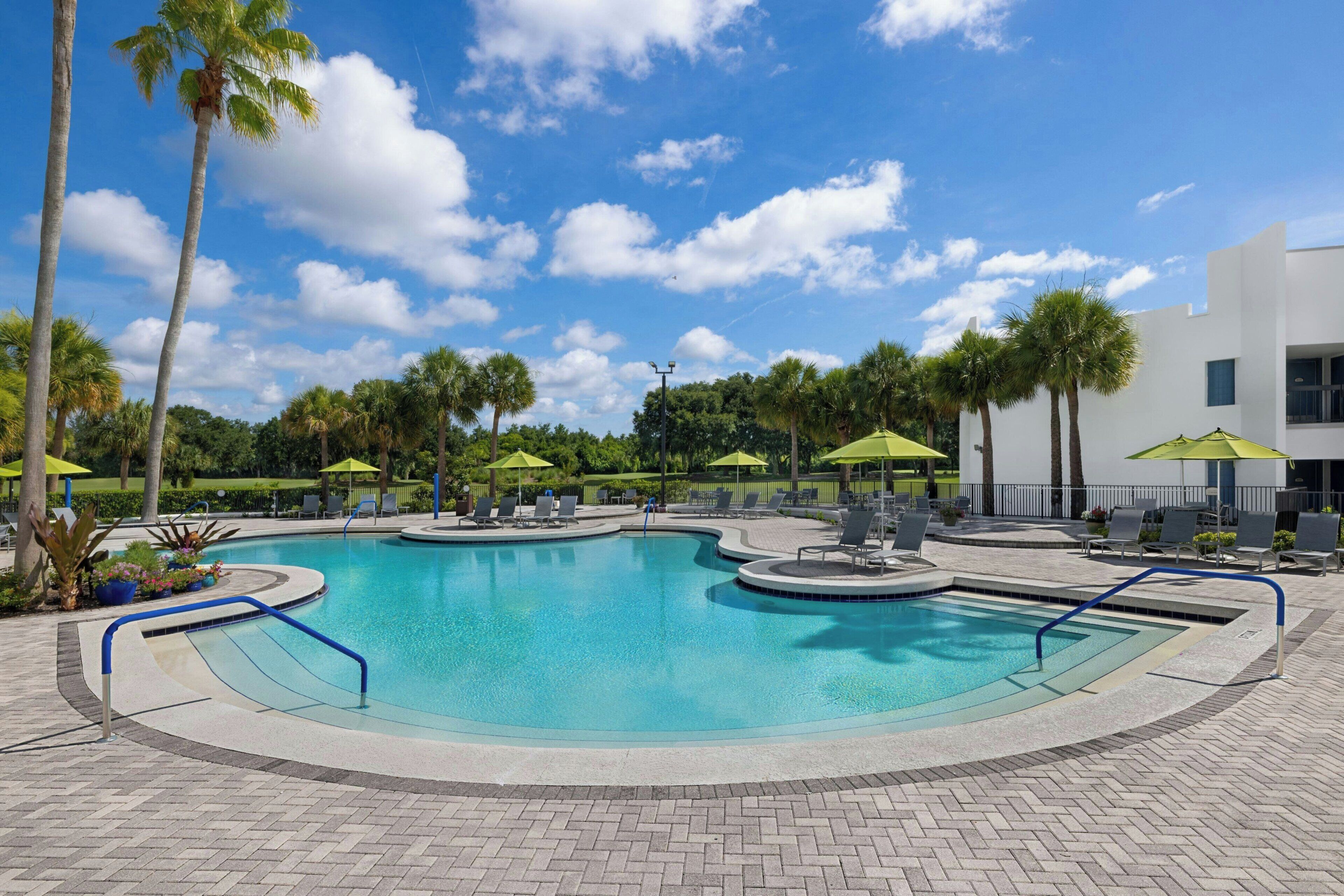Outdoor pool, open 7:00 AM to 11:00 PM, pool umbrellas, sun loungers