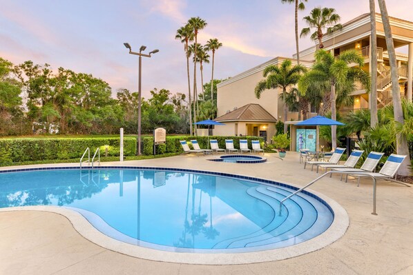 Outdoor pool, a heated pool, pool umbrellas, pool loungers