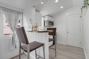 Cottage Suite 138 | Living area | Flat-screen TV - The Palms Hotel (Key West)