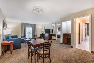 Desk, laptop workspace, blackout drapes, iron/ironing board