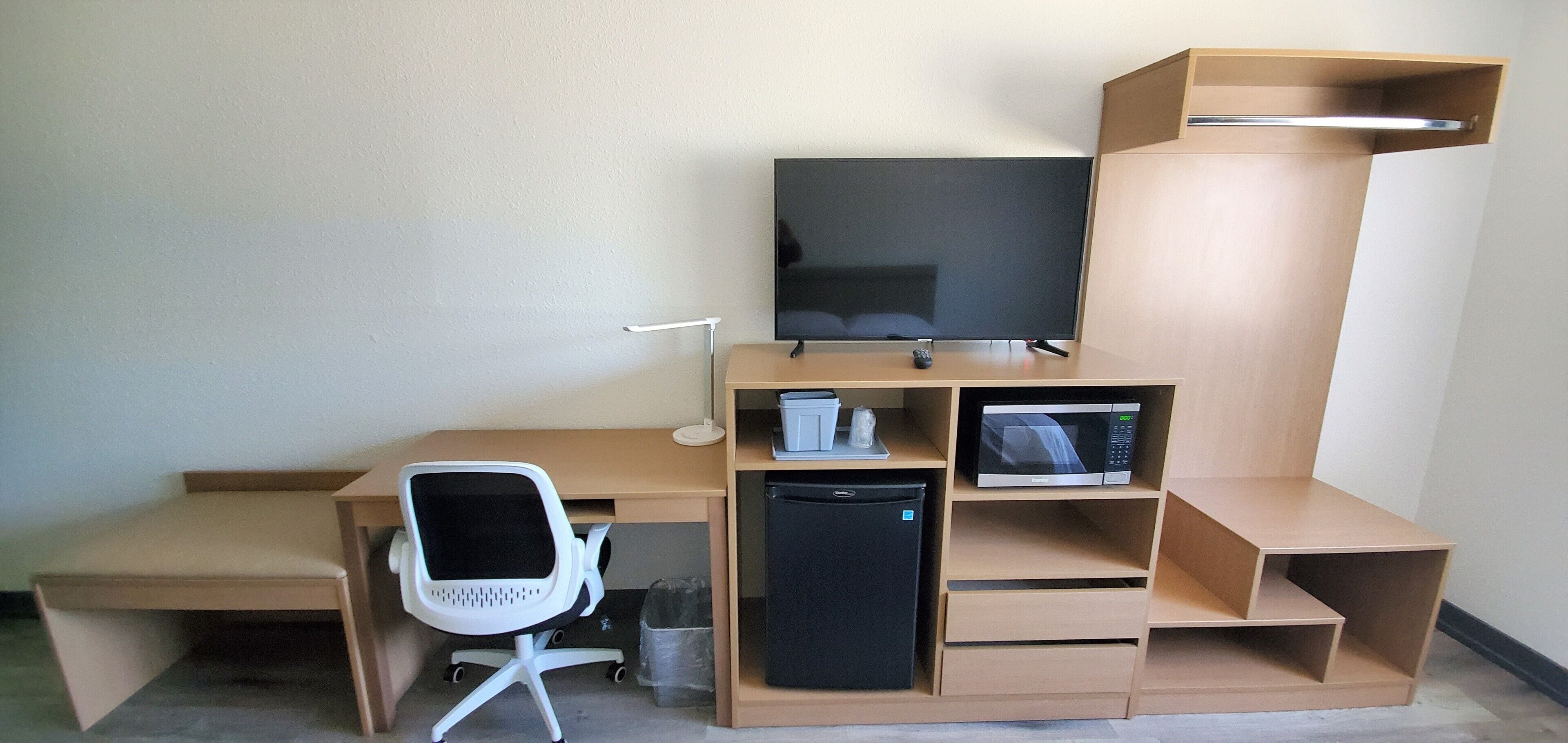 desk, laptop workspace, blackout curtains, iron/ironing board