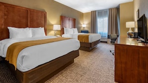 A hotel room with two beds, a desk, a chair, and a television. - Comfort Inn Shelbyville North (Shelbyville)