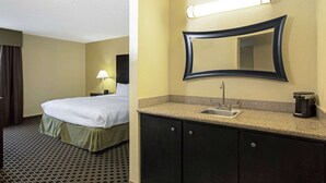 A hotel room with a bed, a nightstand, a lamp, a sink, and a coffee maker.
