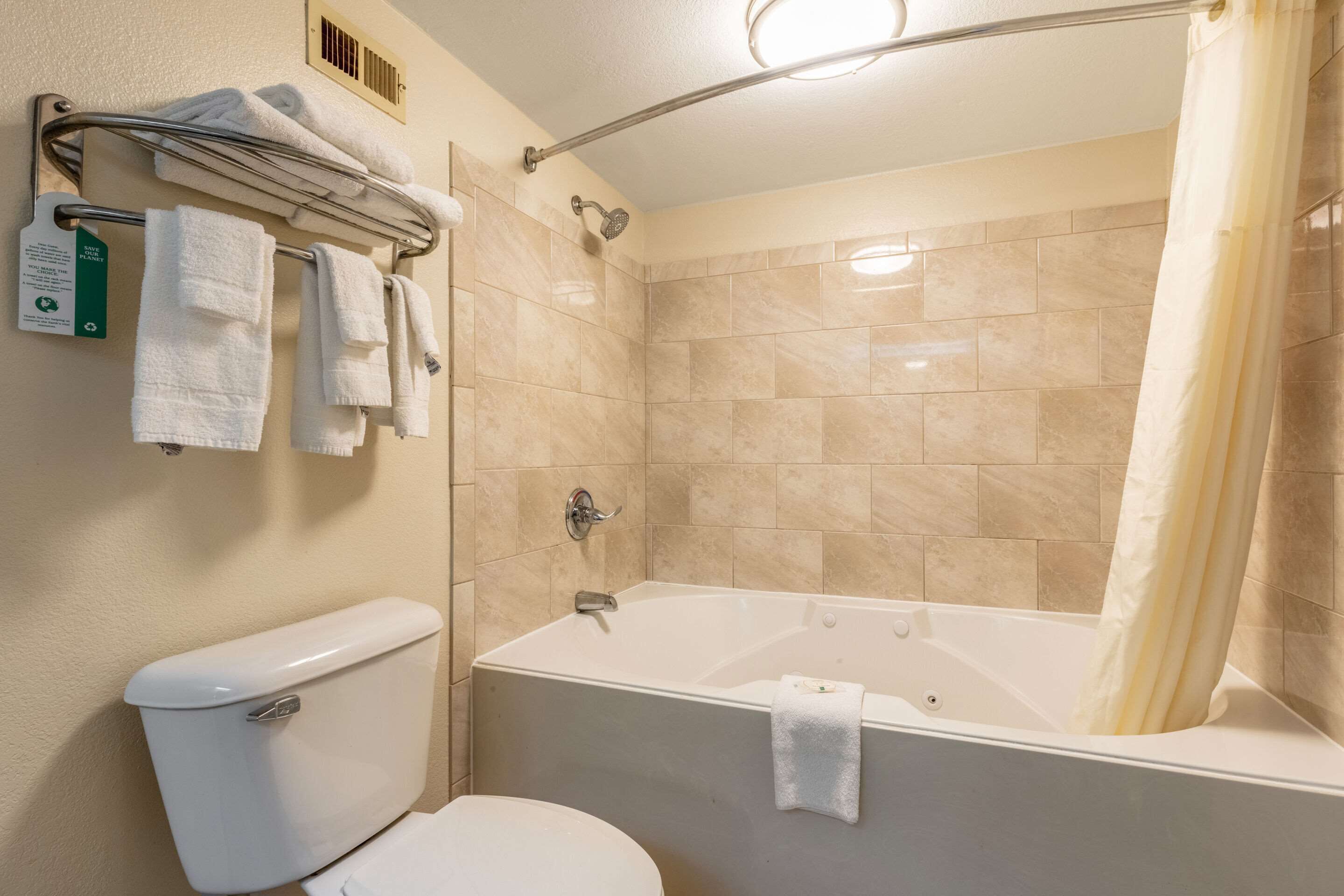 bathtub, free toiletries, hair dryer, towels