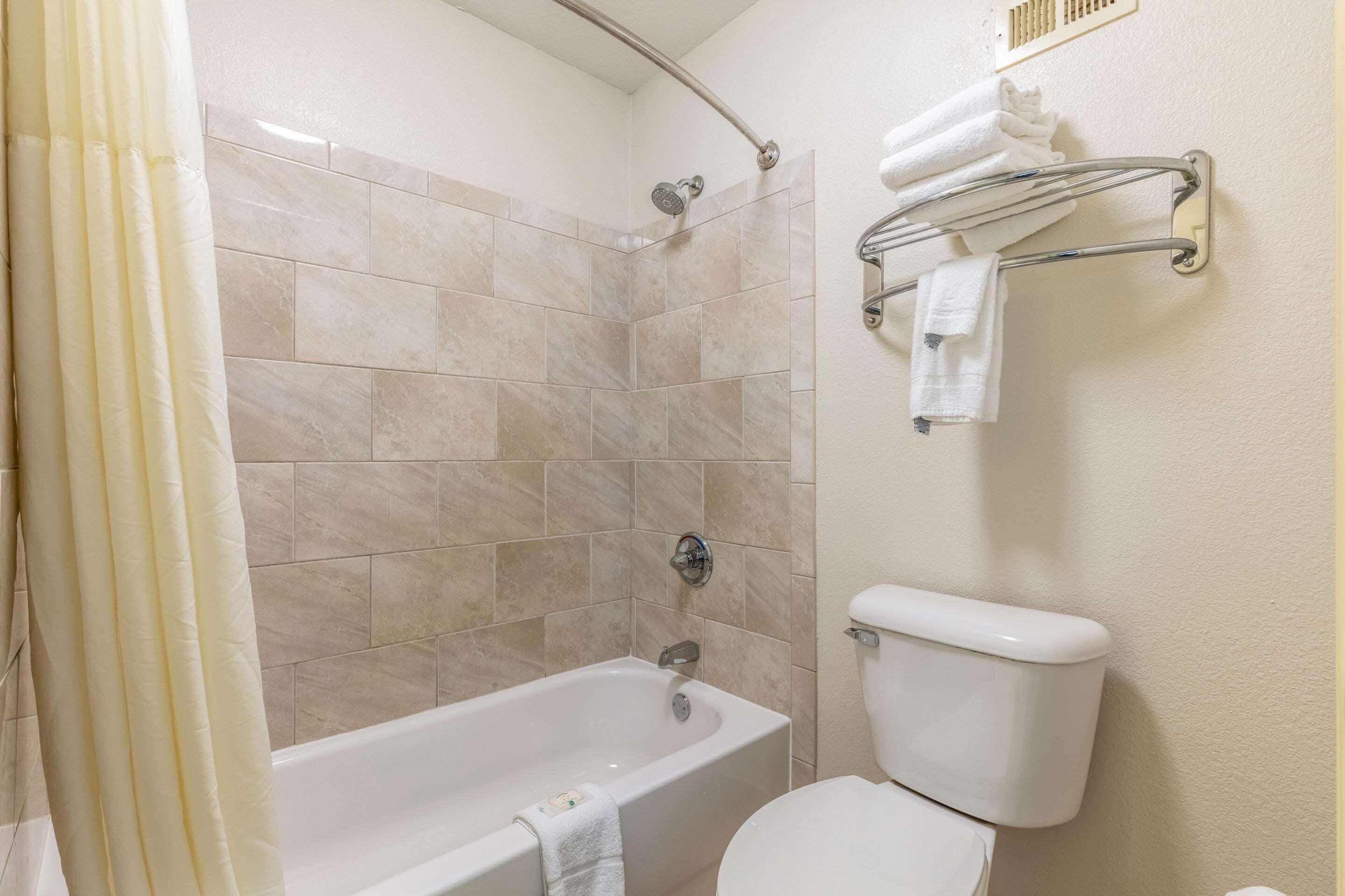 bathtub, free toiletries, hair dryer, towels