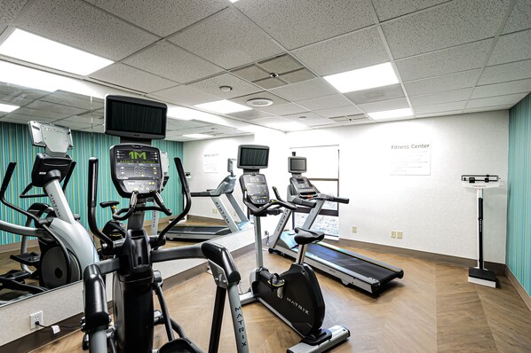 A fitness center with treadmills, elliptical machines, and a stationary bike. - Holiday Inn Express Hillsborough by IHG (Hillsborough)