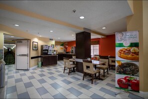 Enjoy a meal at our restaurant, where tables and chairs invite you to dine in style.