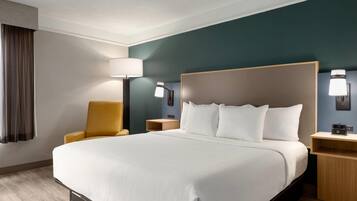 Premium bedding, desk, laptop workspace, iron/ironing board