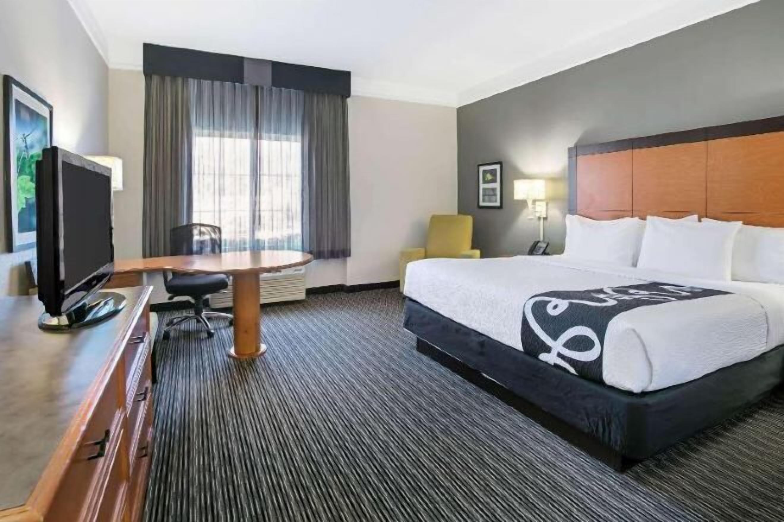 Premium bedding, desk, laptop workspace, iron/ironing board