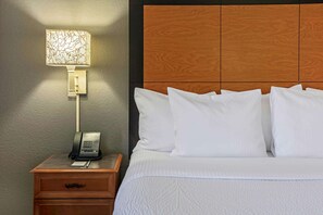 Premium bedding, desk, laptop workspace, iron/ironing board