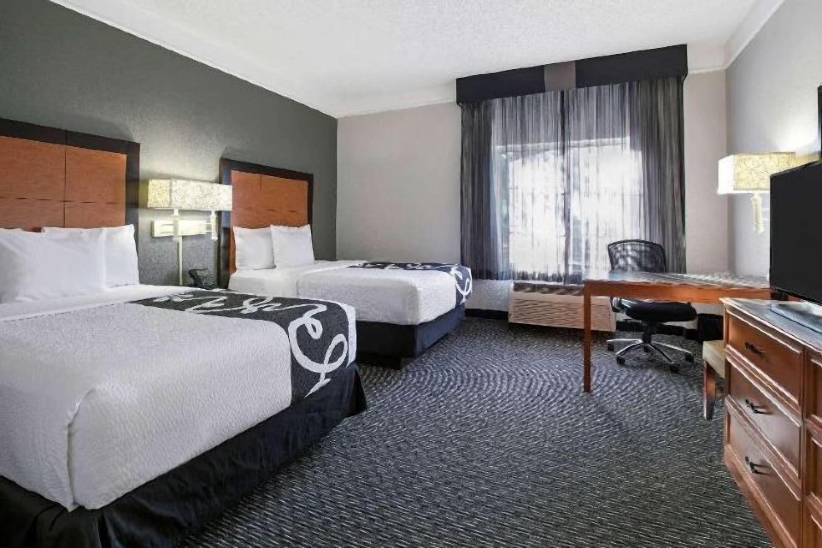 Premium bedding, desk, laptop workspace, iron/ironing board