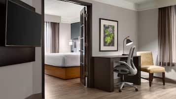 Premium bedding, desk, laptop workspace, iron/ironing board