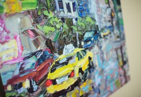 A close-up of a textured wall with abstract patterns and colors.