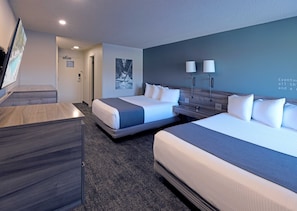 Premium bedding, desk, laptop workspace, blackout drapes