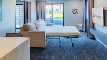 Premium bedding, desk, laptop workspace, blackout curtains