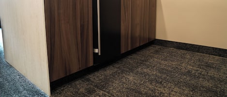 A kitchen with a built-in refrigerator, a sink, and a countertop.