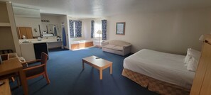 Deluxe Room, 1 King Bed, Jetted Tub | 1 bedroom, pillowtop beds, iron/ironing board, rollaway beds