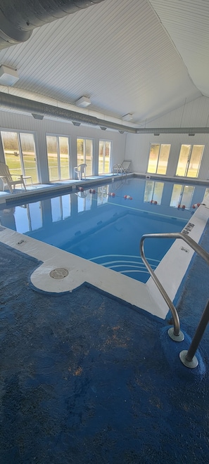 Indoor pool, open 10:00 AM to 10:00 PM, pool loungers
