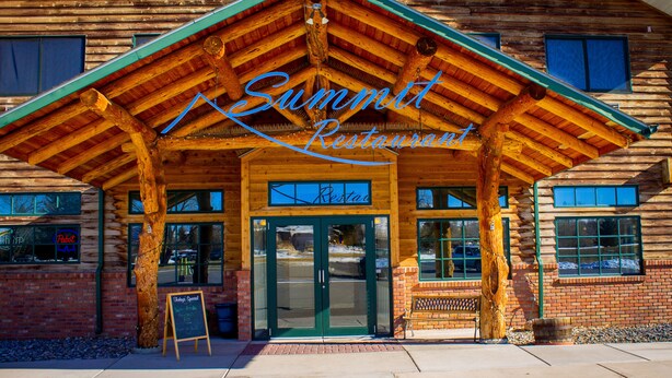 A wooden building with a sign reading "Summit Restaurant". - Inn at Lander, Travelodge by Wyndham (Lander)