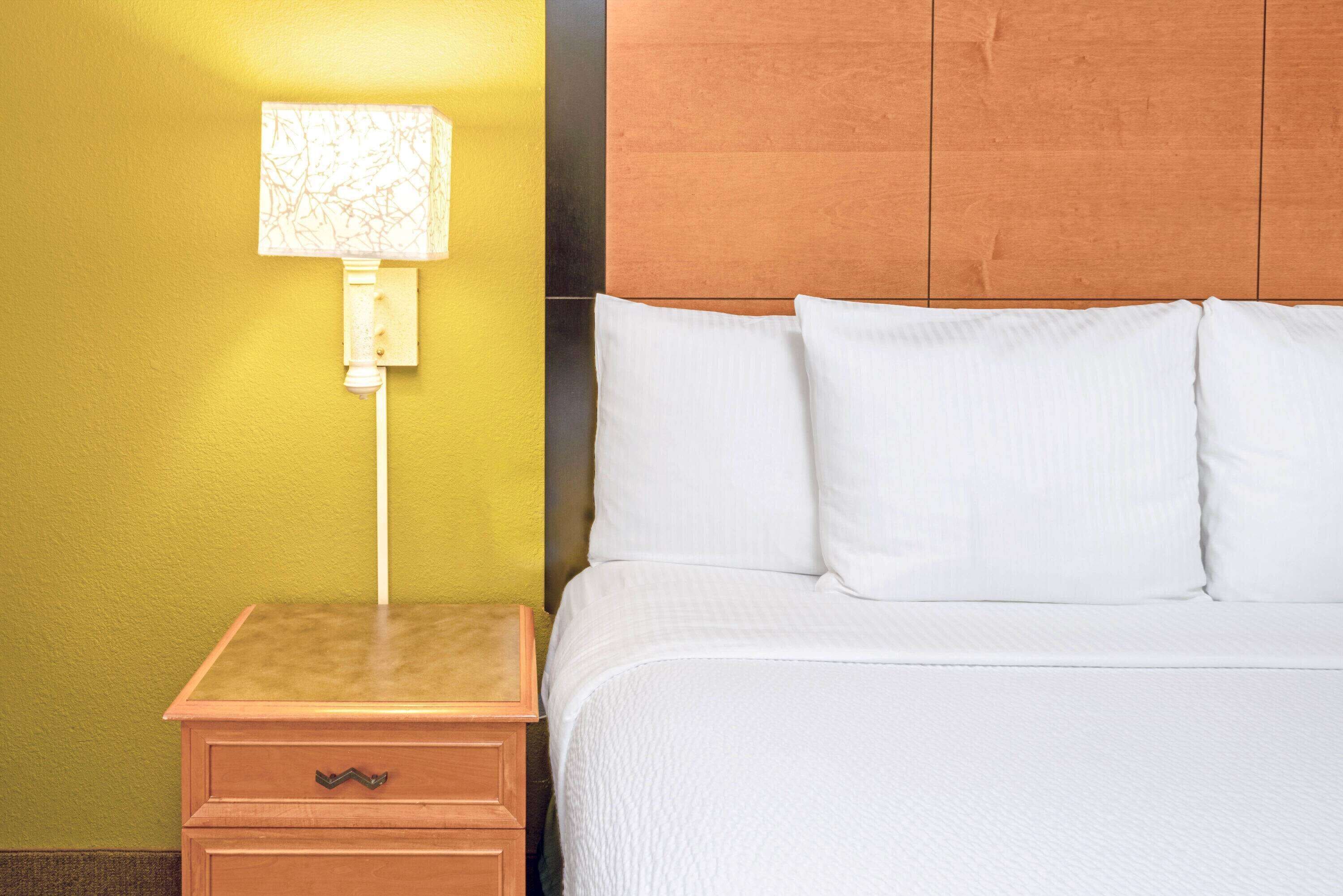 premium bedding, desk, blackout curtains, iron/ironing board