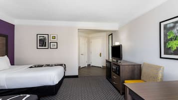 Premium bedding, desk, laptop workspace, blackout drapes