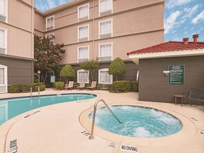 Outdoor pool, open noon to 10:00 PM, pool umbrellas, pool loungers