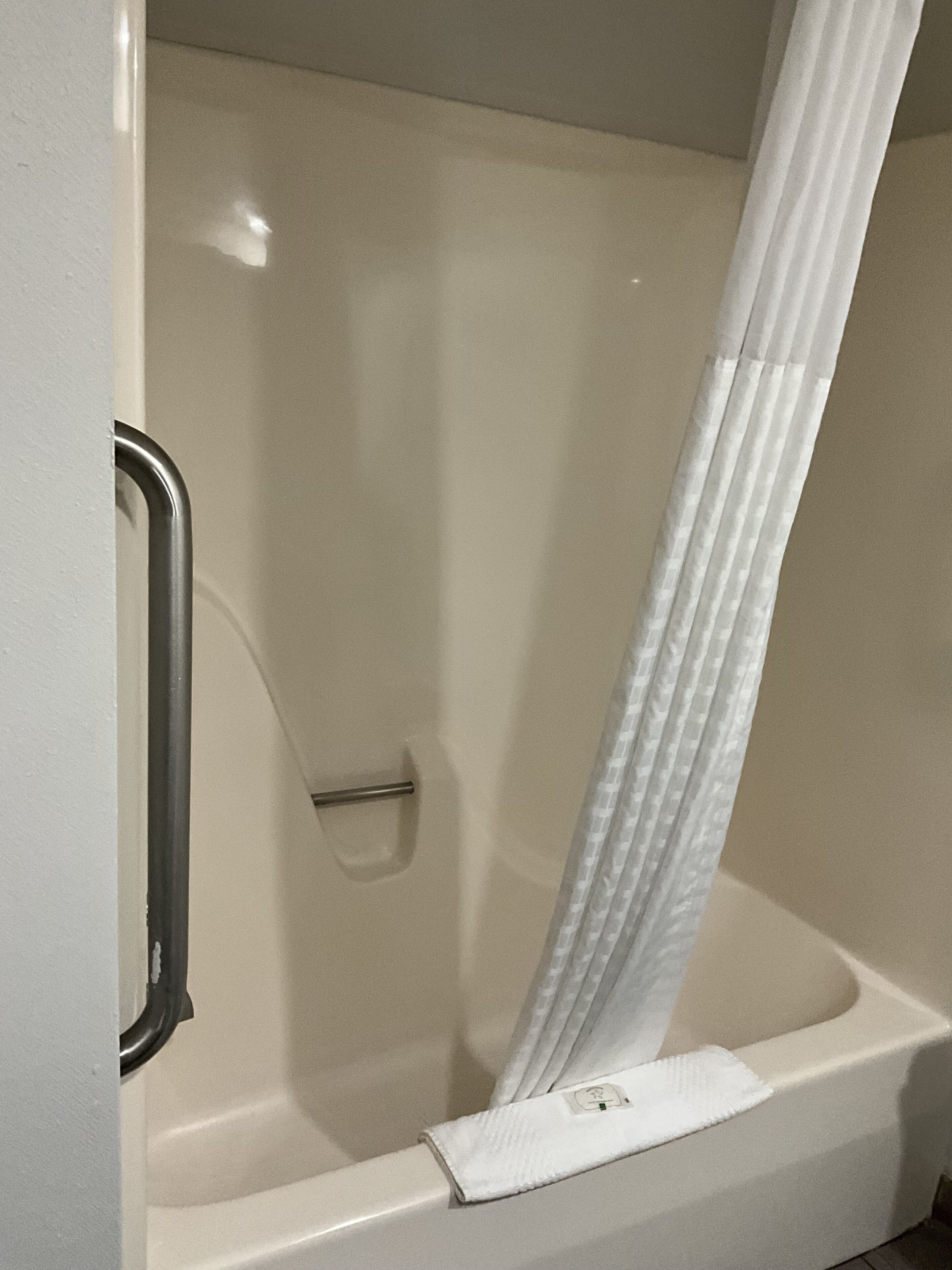 bathtub, hair dryer, towels