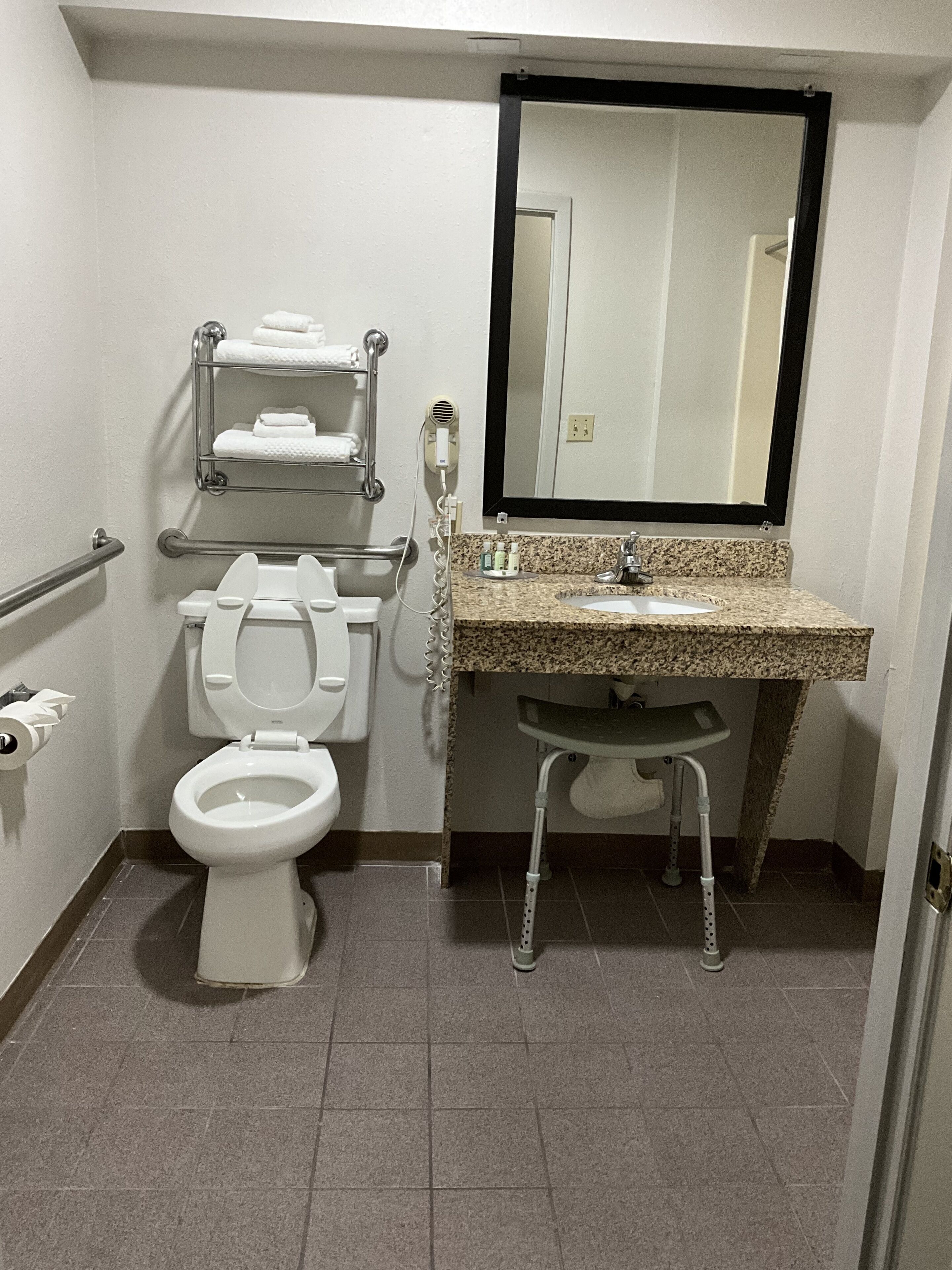 bathtub, hair dryer, towels