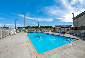 Seasonal outdoor pool, pool loungers