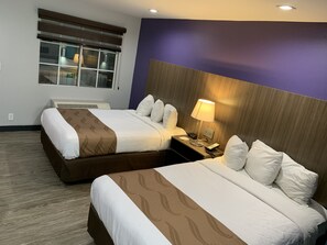 Premium bedding, pillow-top beds, desk, laptop workspace