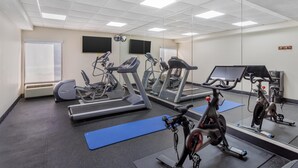 A gym with treadmills, elliptical machines, and stationary bikes, equipped with mirrors and exercise mats. - Best Western Plus Madison (Madison)