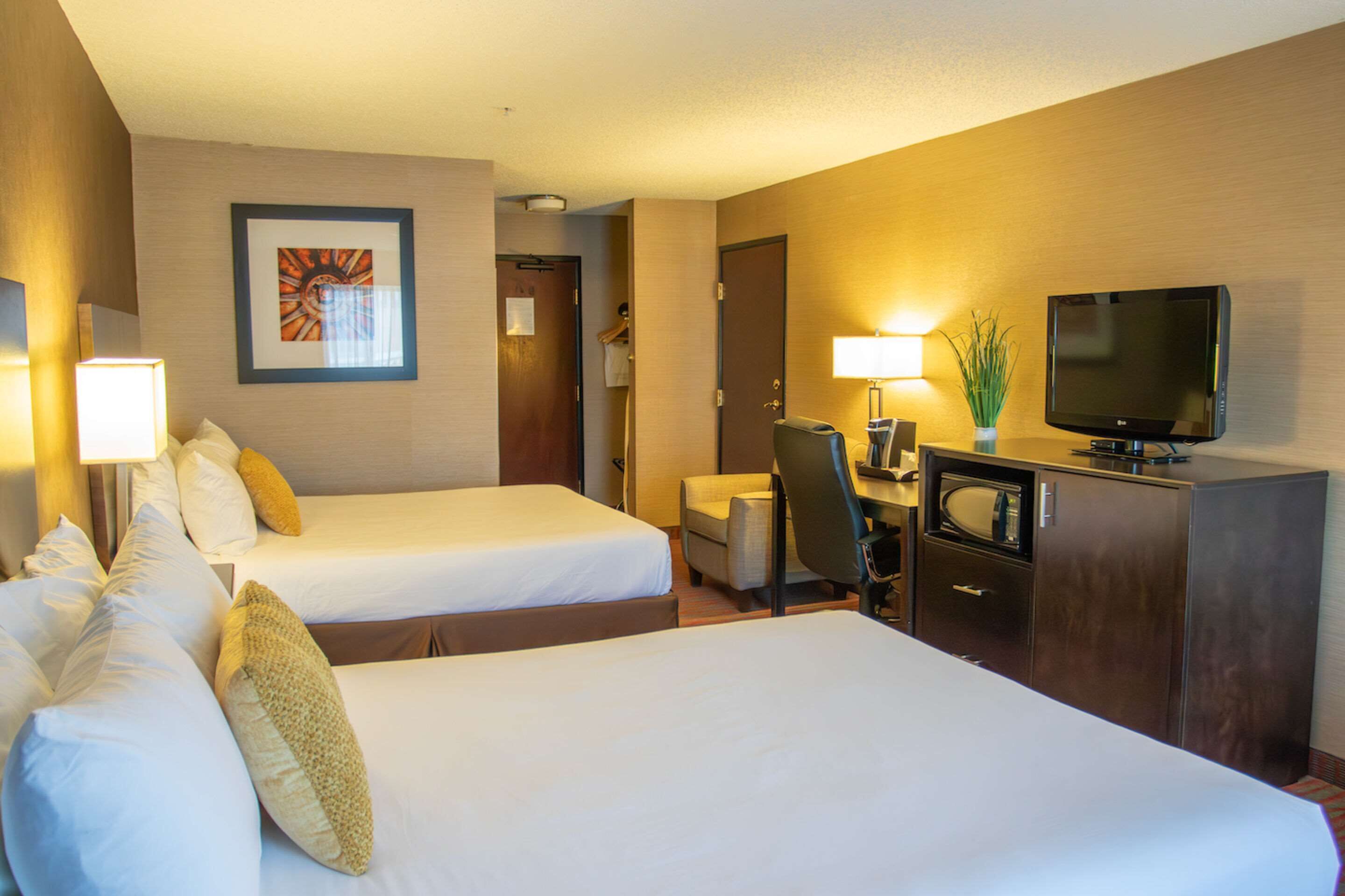 room, 2 queen beds, non smoking | in-room safe, desk, iron/ironing board, cots/infant beds