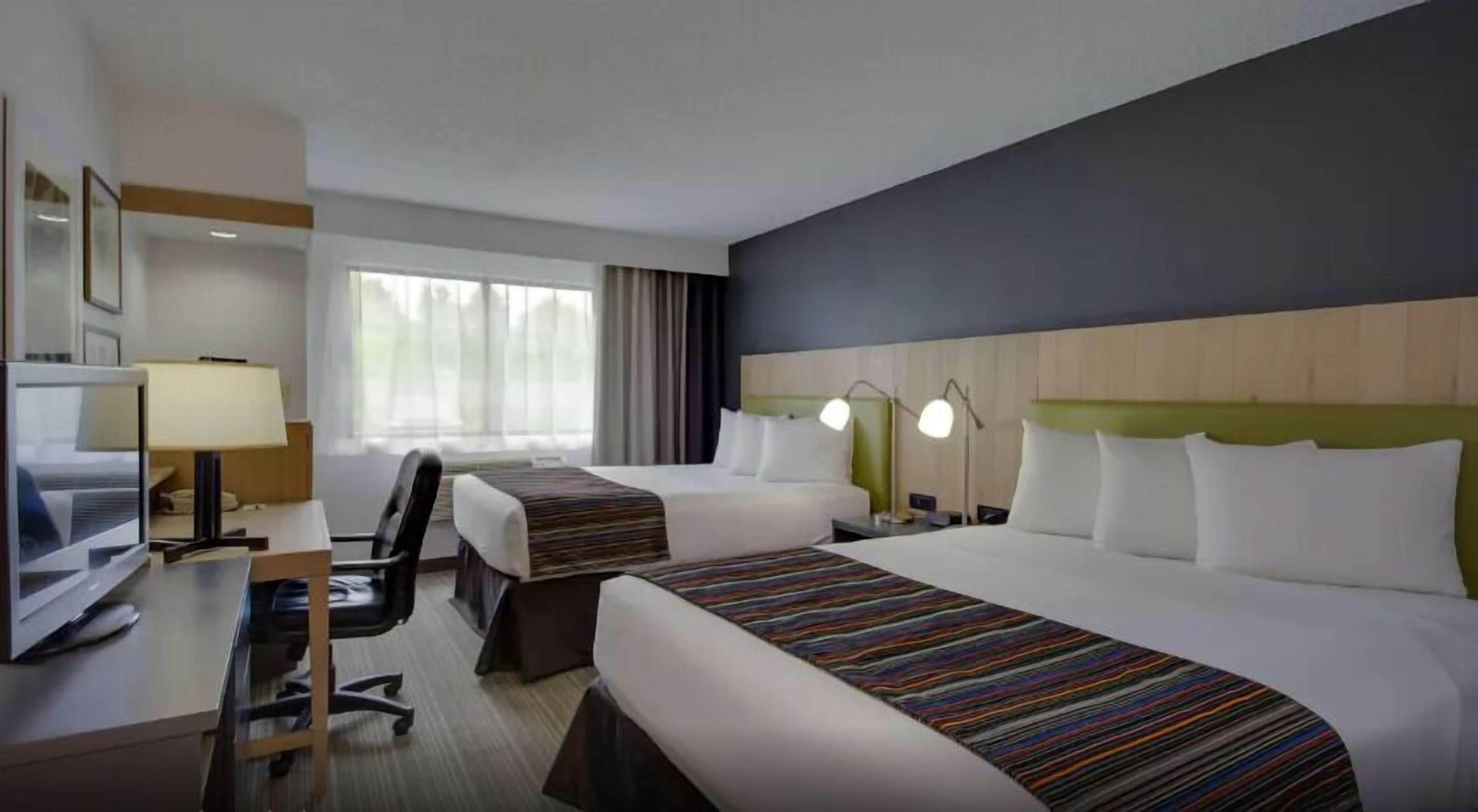 Luxe beddengoed, donsdekens, pillowtop-bedden, een kluis op de kamer