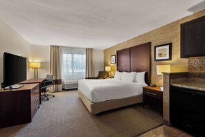 Premium bedding, desk, laptop workspace, iron/ironing board